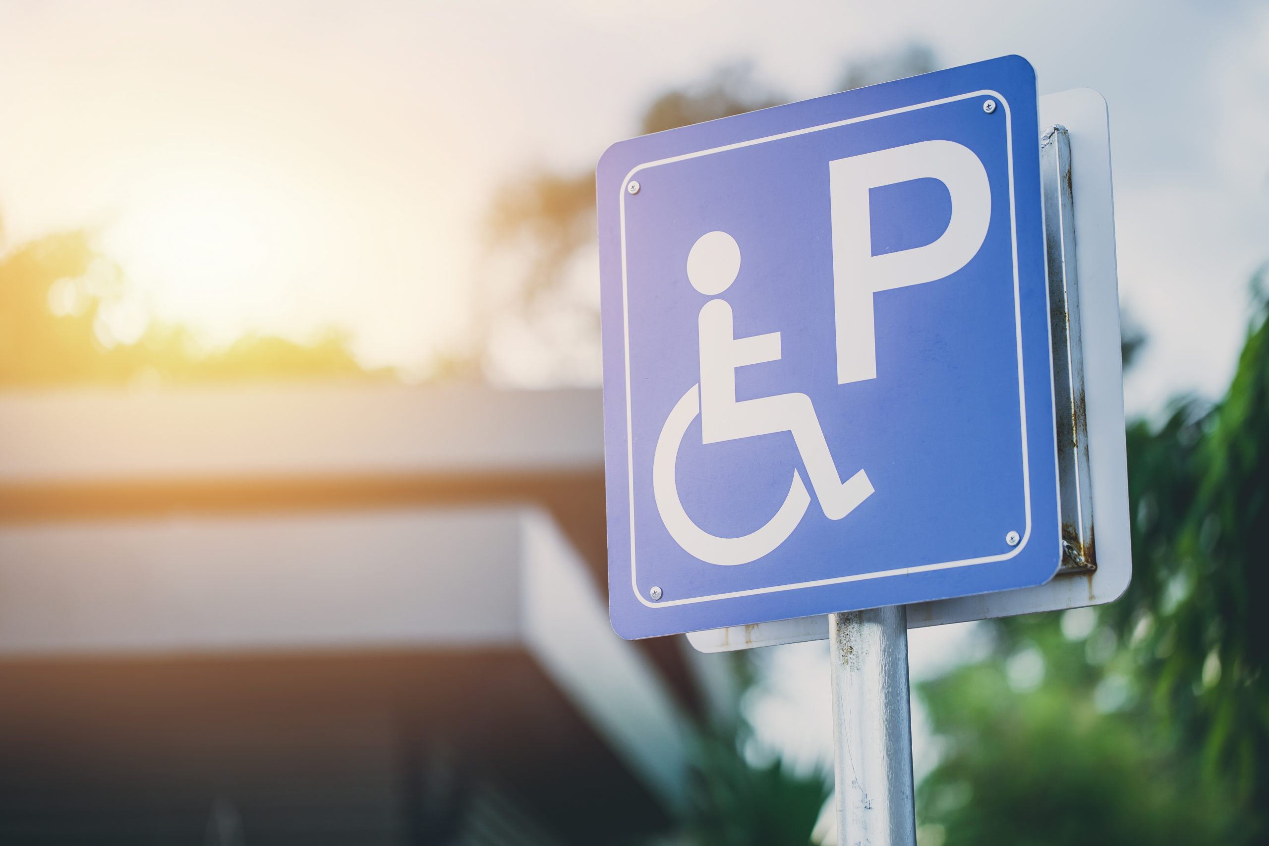 Picture of a sign with a handicap icon for handicap parking